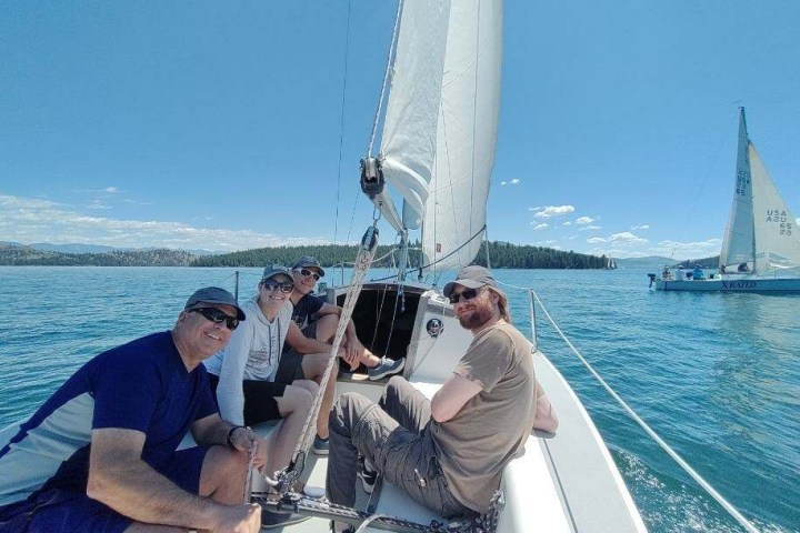 a group of people in a boat on a body of water