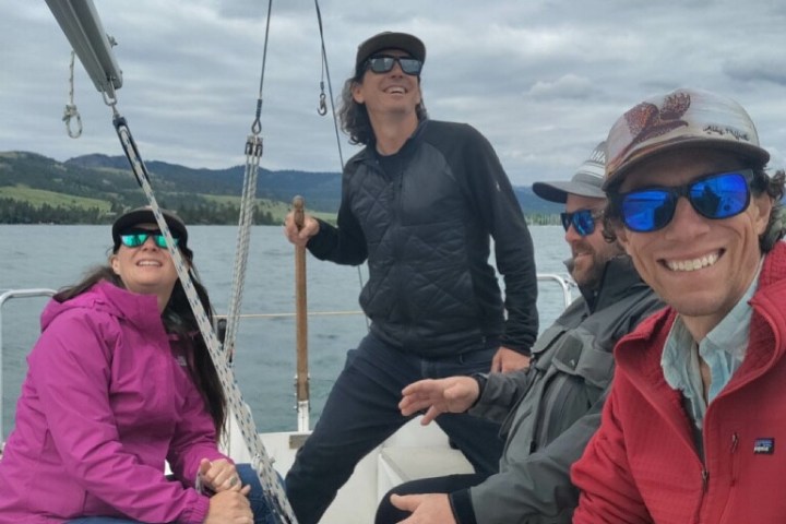 a group of people riding on the back of a boat