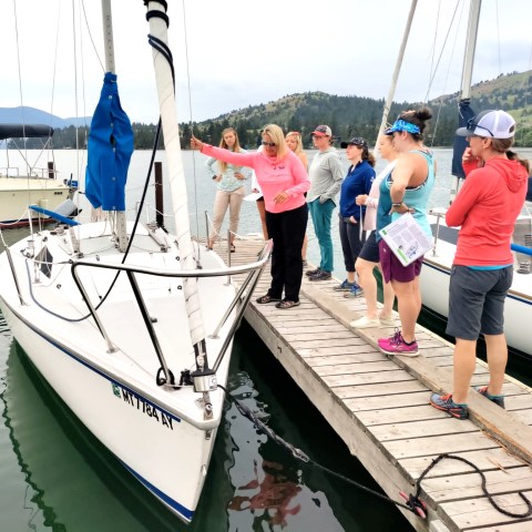 a group of people standing on a boat