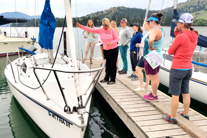 a group of people standing on a boat