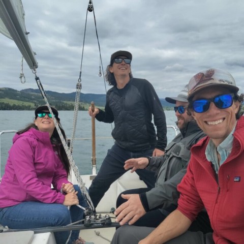 a group of people riding on the back of a boat