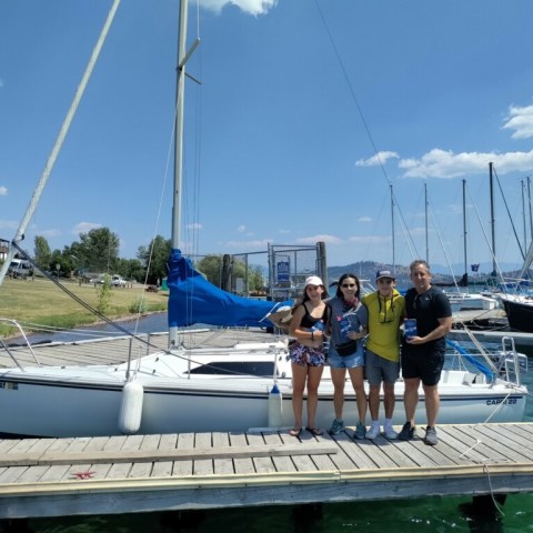 a group of people in a boat on a body of water