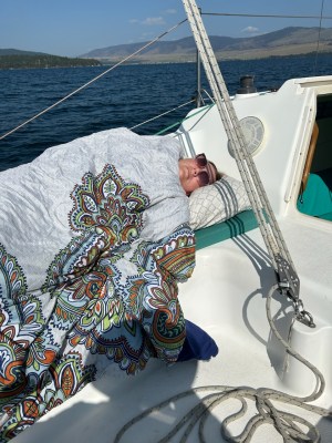 a close up of a boat next to a body of water