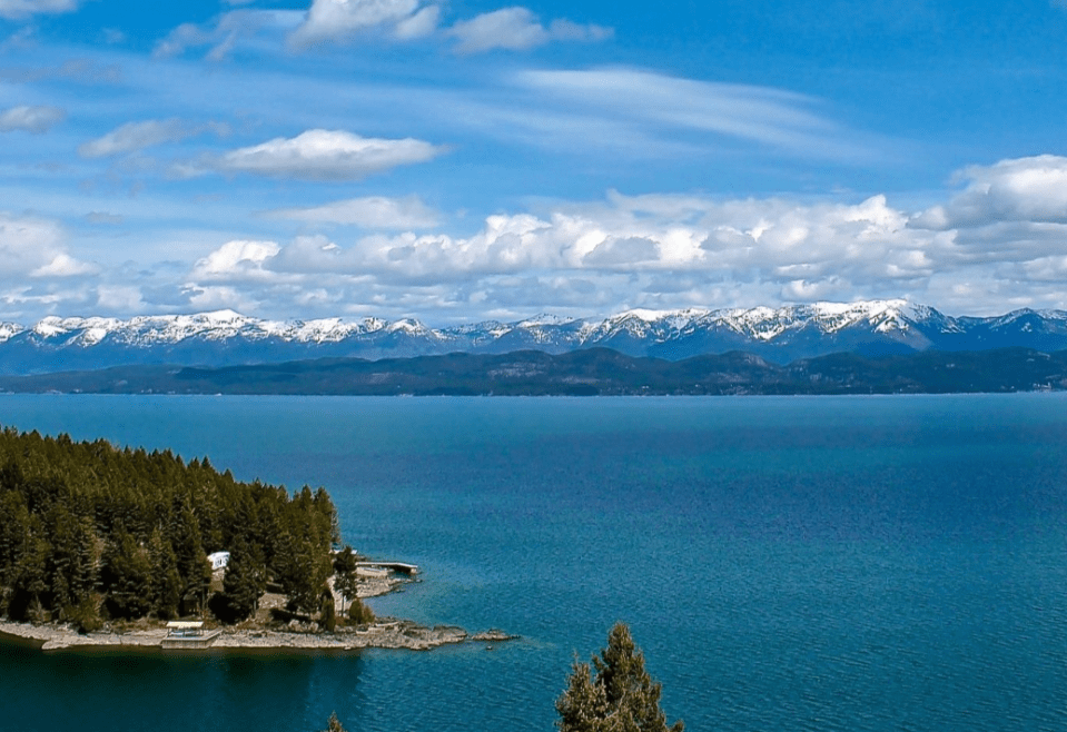 Screenshot 2025-05-05 164836 a large body of water with a mountain in the background